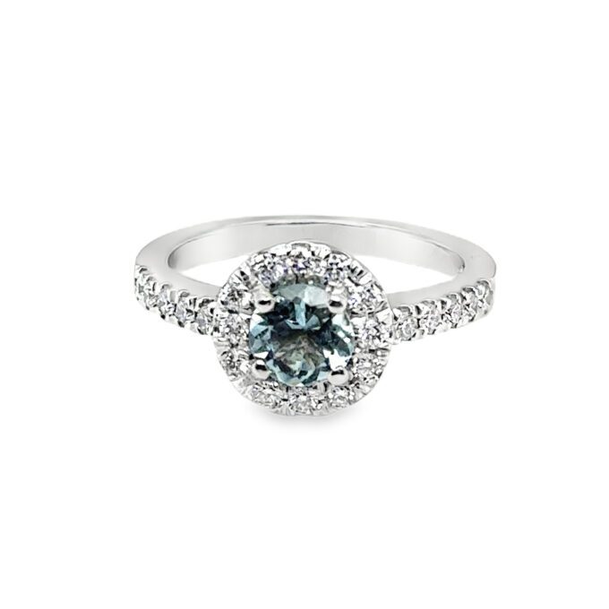 18c WG Aquamarine and Diamond cluster ring with a 5.5mm centre and total of 0.32c round brilliant diamonds