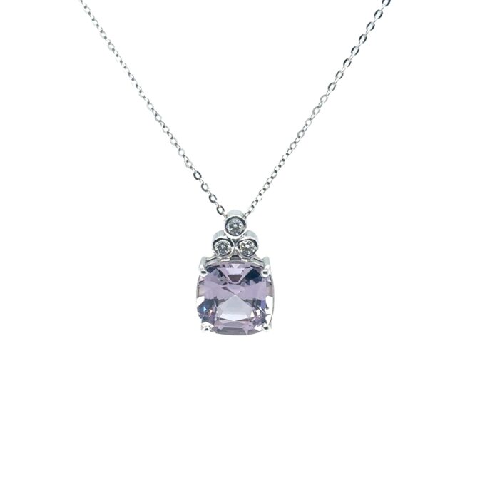 18ct WG pendant bezel set with three diamonds totalling 0.11ct and four claw set with one cushion cut Lilac Spinel weighing 4.03ct