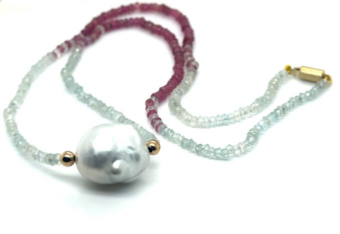 faceted aquamrine and tourmaline beads 50cm with a 18mm Baroque Broome pearl on gold barrel clasp